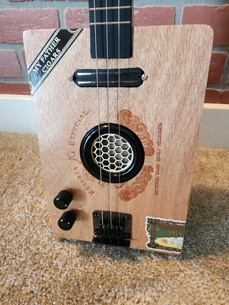 wooden cigar box guitar with honeycomb