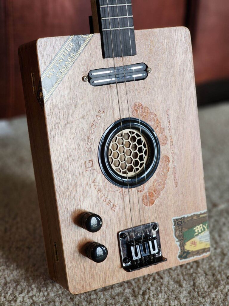 wooden cigar box guitar with honeycomb