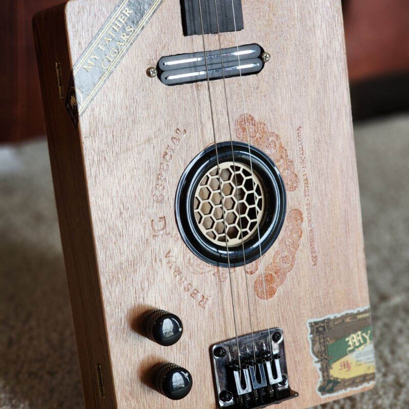 wooden cigar box guitar with honeycomb