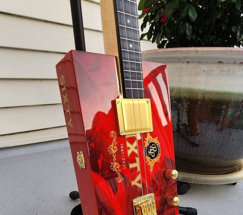 red cigar box guitar